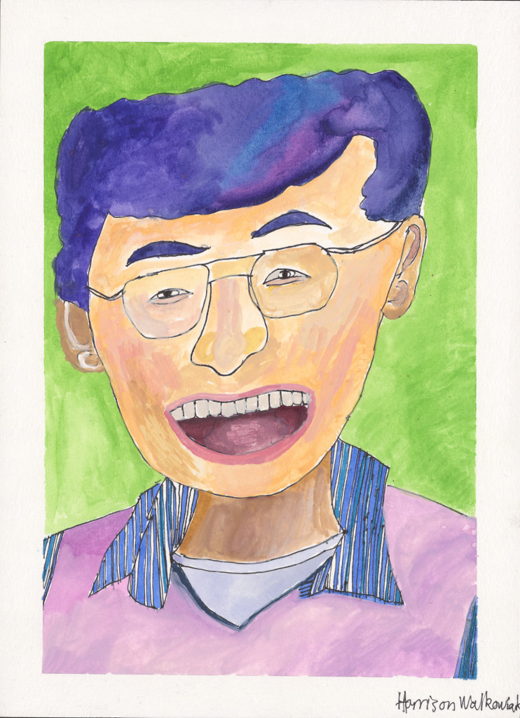 An Asian American man with wire-rimmed glasses has a broad smile that is almost a laugh. His hair is blue and the same color as his striped shirt.